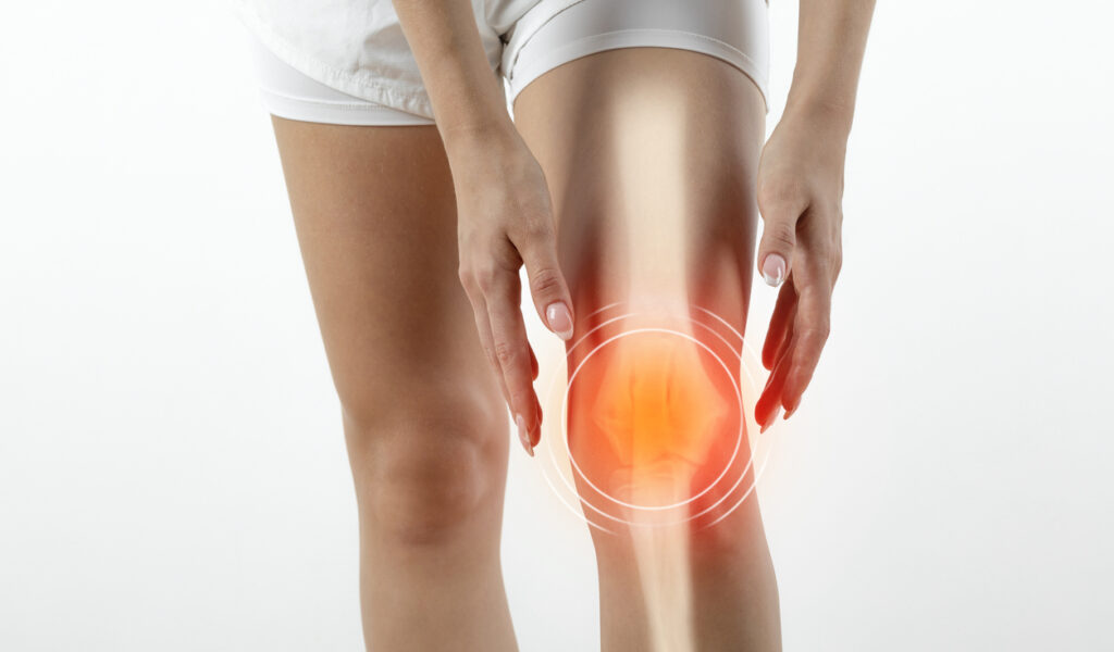 Woman suffering from pain in knee